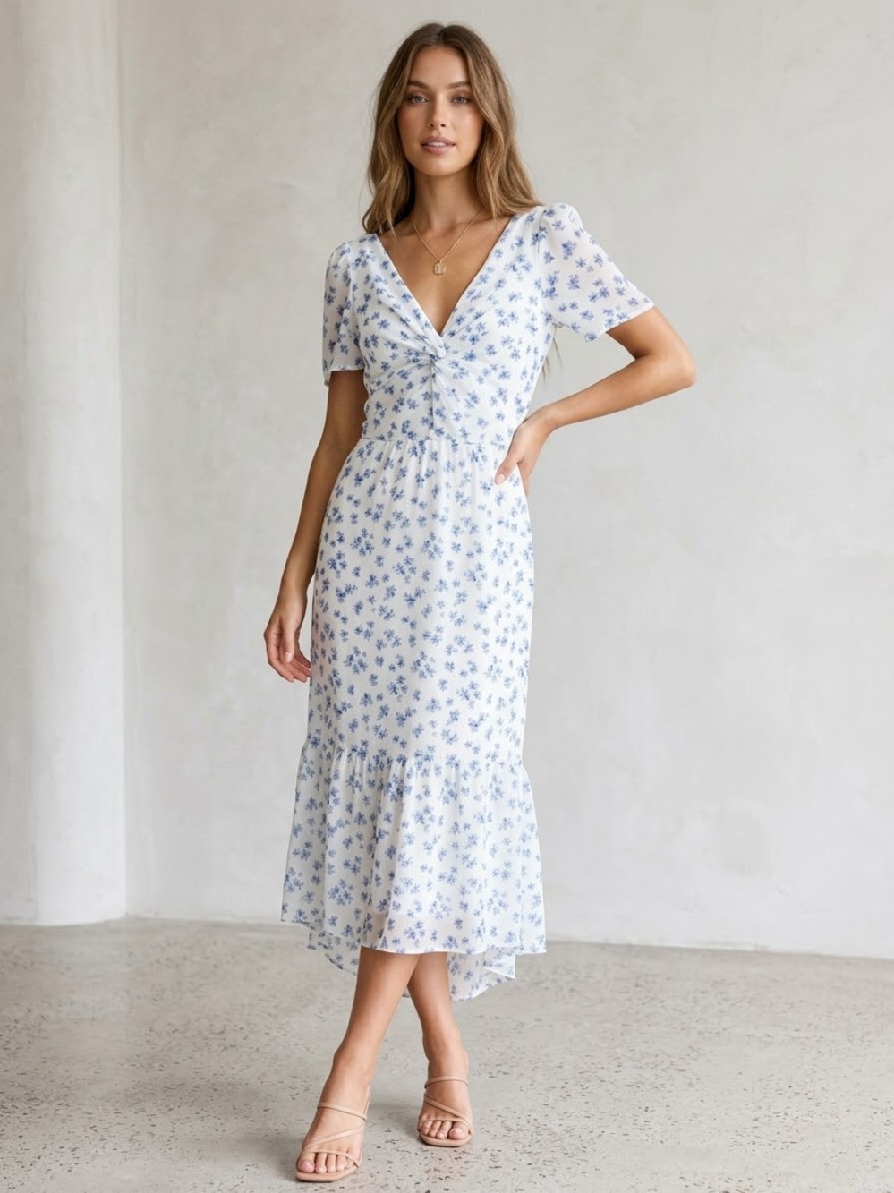 Floral V-Neck Midi Dress in White and Blue from
Dillards